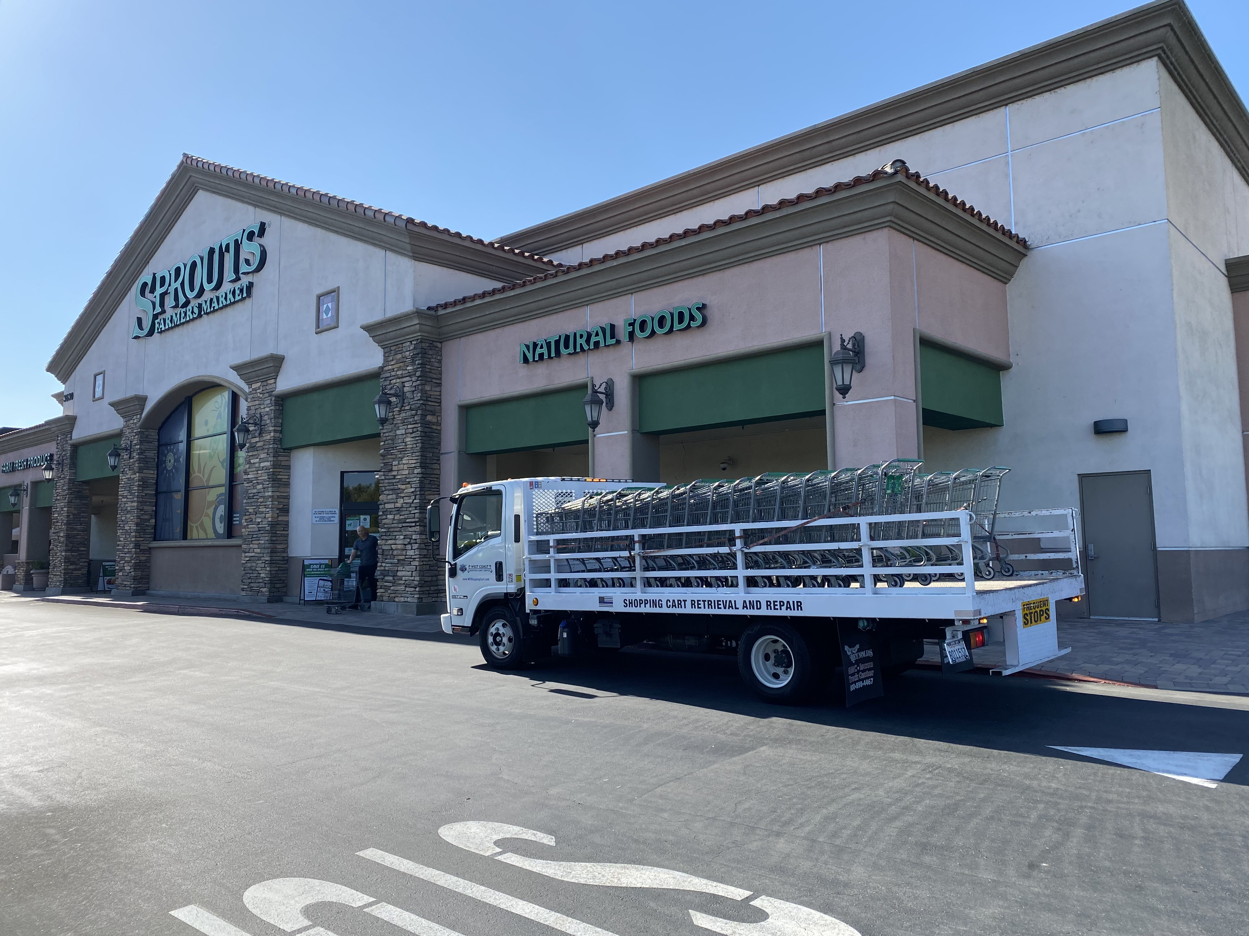 West Coast Shopping Cart Service truck delivering carts at Sprouts Farmers Market